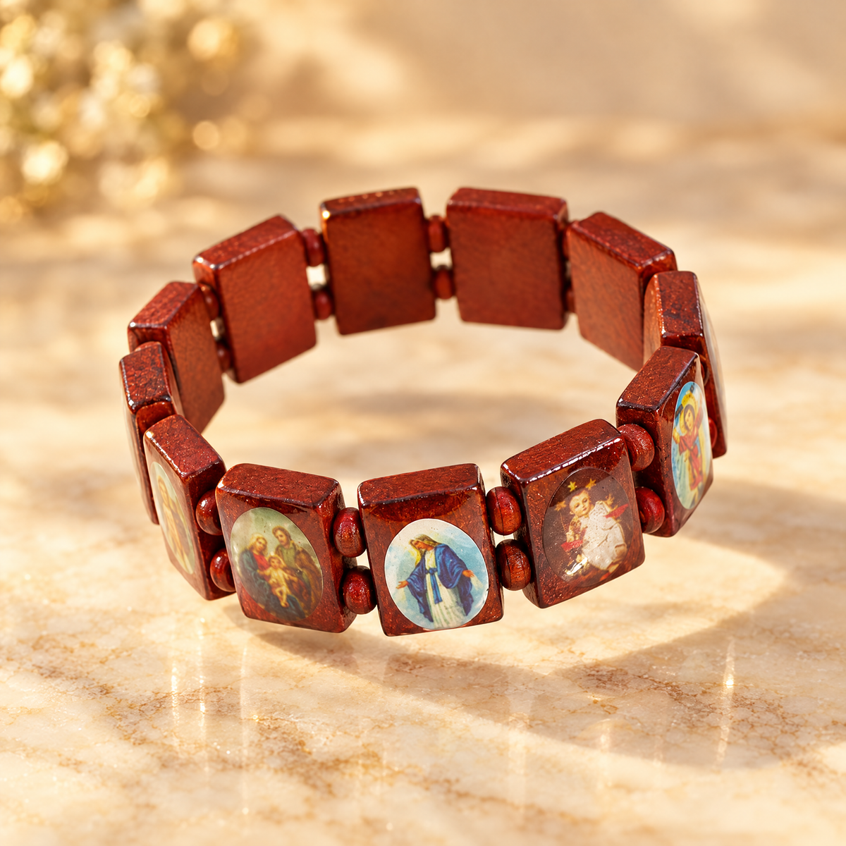 Red wooden saints rosary bracelet on cream marble