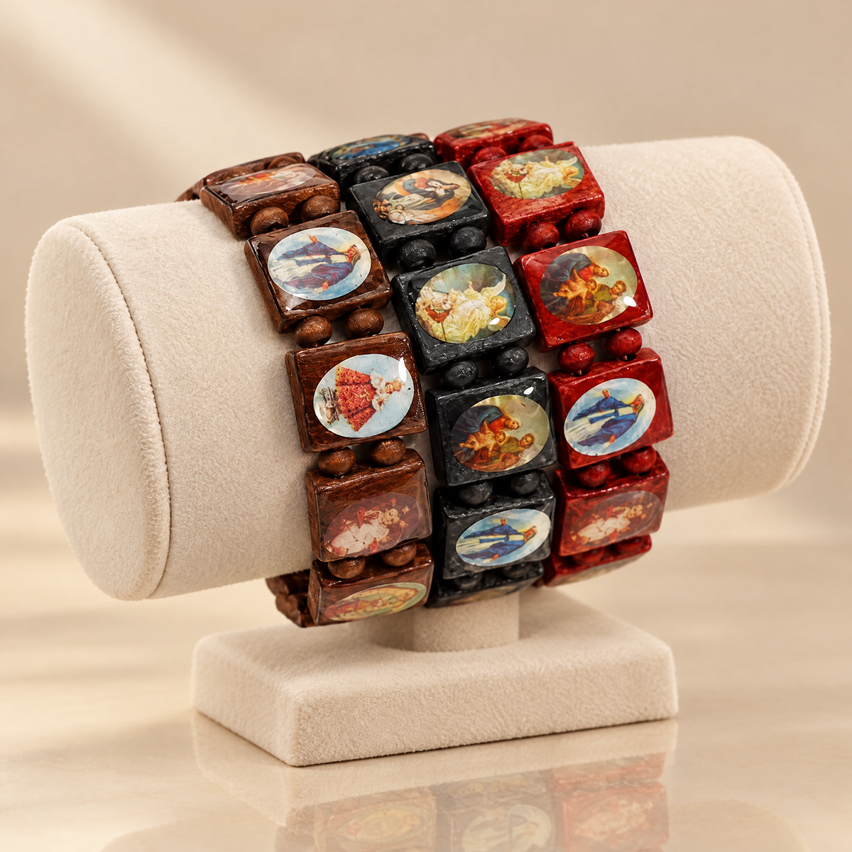 Stacked brown, black and red wooden saints bracelets on a jewelry display
